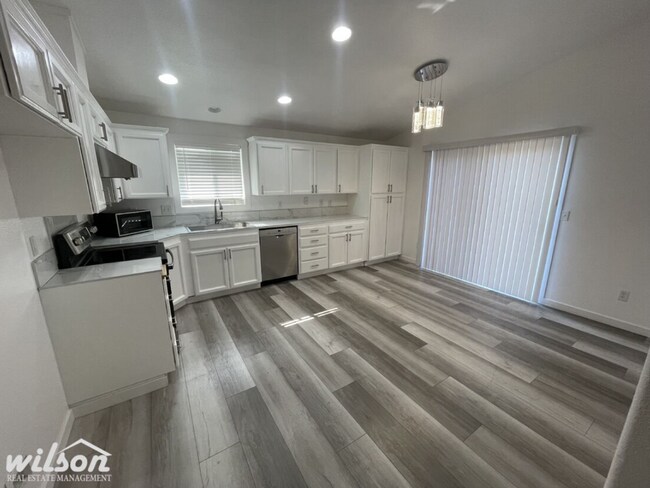 Building Photo - 3 Bed, 2 Bath Home with a Two-Car Garage, Fenced Backyard, and Lawn Care Included