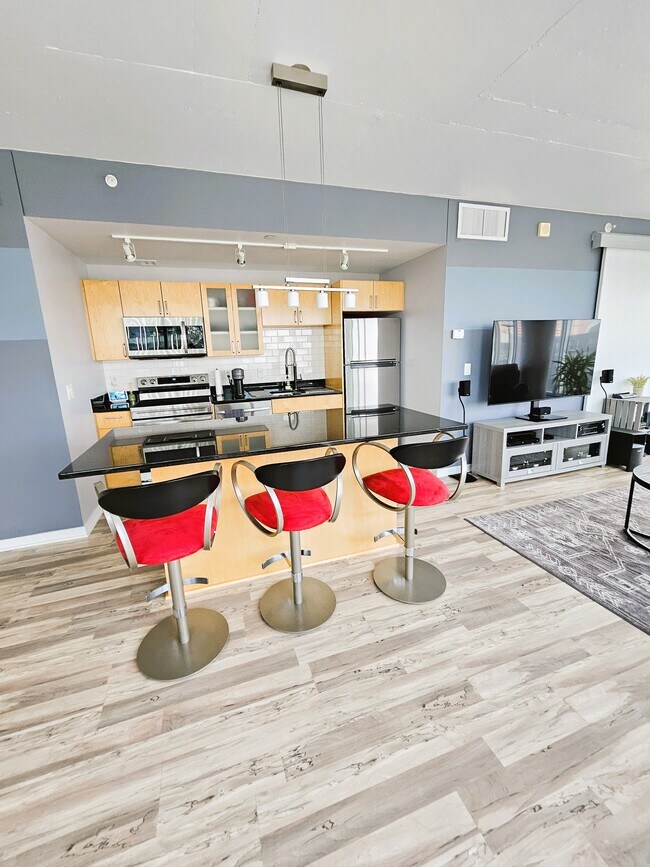 Beautiful center island kitchen with granite counters and stainless appliances - 8161 33rd Ave S