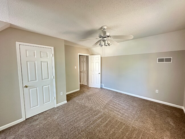 Building Photo - Charming 3BR/2BA Near Southwind | Hardwood Floors, Brick Fireplace, Bay Window & 2-Car Garage