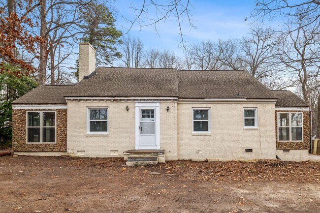 Building Photo - Brick home, Two Story, Hardwoods, DR, 2 Sun Rooms, FP, Carport!.