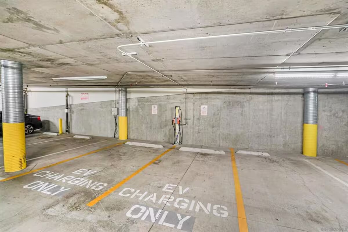 Gated garage with reserved spaces and EV charging station. - 3687 4th Ave