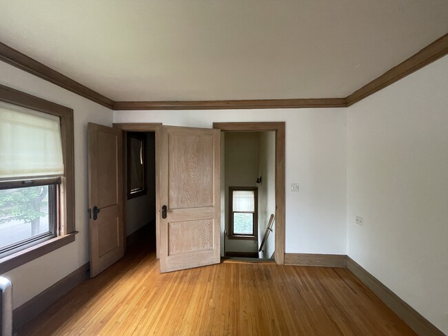 View of front entrance from living room. Door on the left leads to a walk-in closet. - 4235 Pleasant Ave