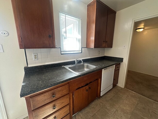 Building Photo - Three Bedroom Two Bathroom Home with Yard