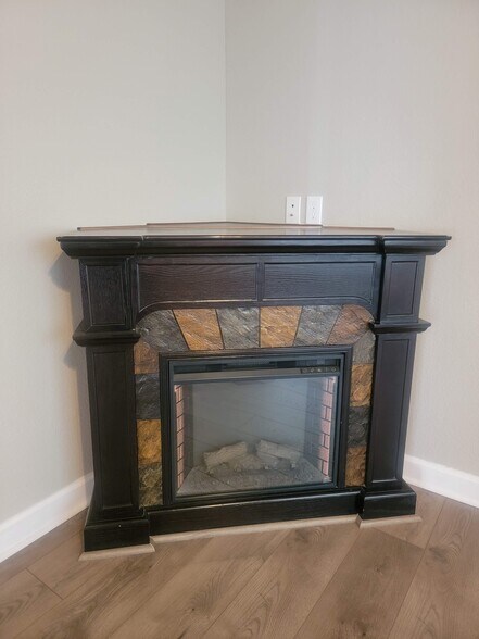 Warm, cozy electric fireplace - 218 N Washington St