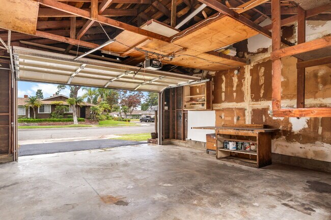 Building Photo - Charming Updated Home With Drive-Through Garage Access