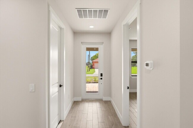 Building Photo - New 3/2 Pool Home for Rent on Canal, Fenced Yard, Pets Welcome. Your Dog Approves of This Backyard