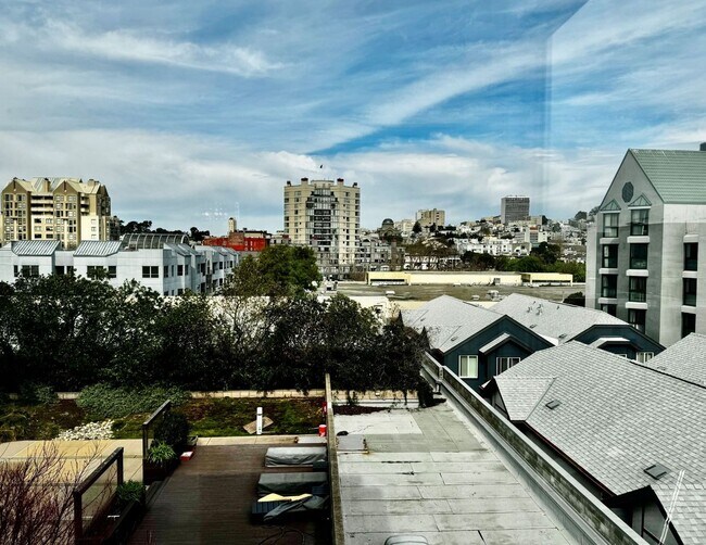 Building Photo - Corner Light. City Energy. Zero Compromise.