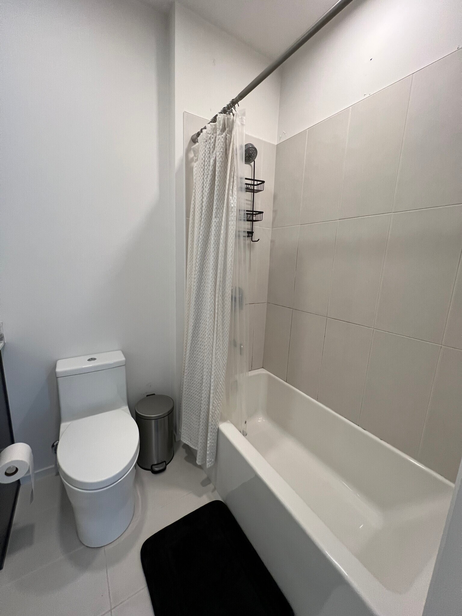 Shower and modern flush toilet - 806 Olympic St