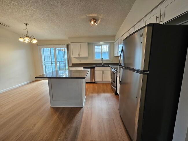 Building Photo - Charming Single-Level Home Featuring New Hardwood Floors, Bright Bedrooms & Open-Concept Living