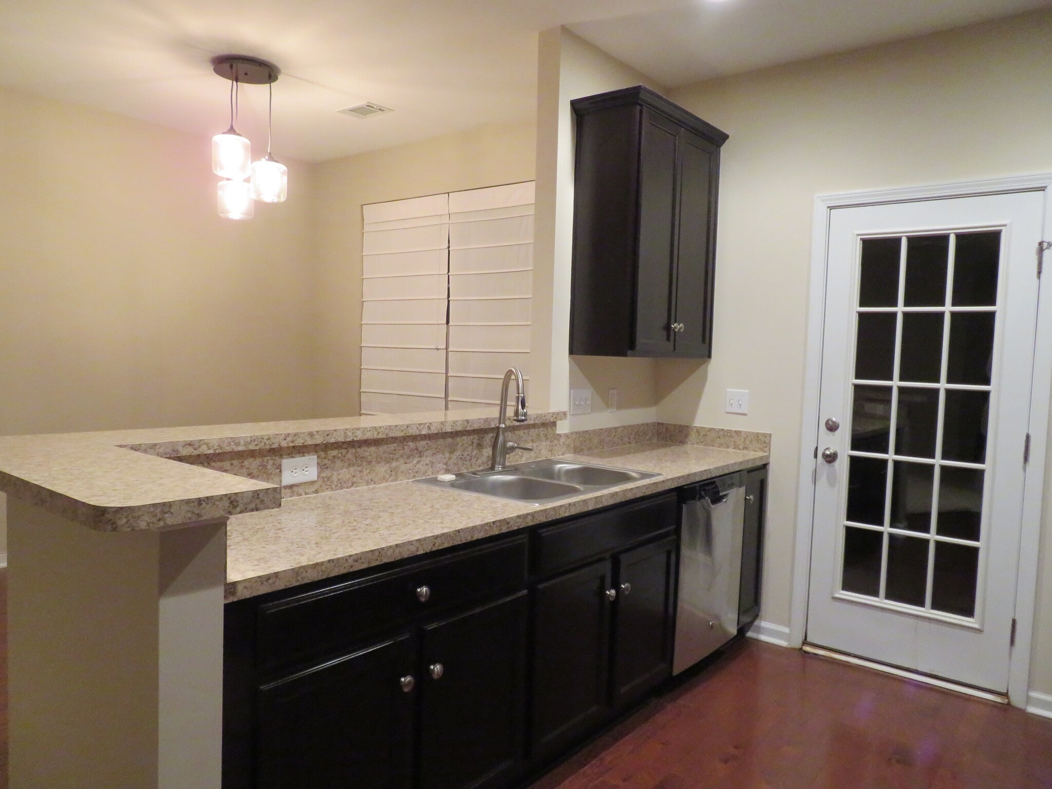 Kitchen, looking over breakfast bar to Dining & door to backyard - 2496 Stadium Dr