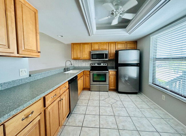 Large kitchen with stainless appliances - 4708 SW 8th Pl