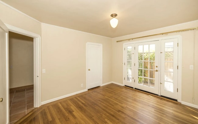 Building Photo - Charming Spanish Style Cottage with Incredible Deck- Gardener's Delight!