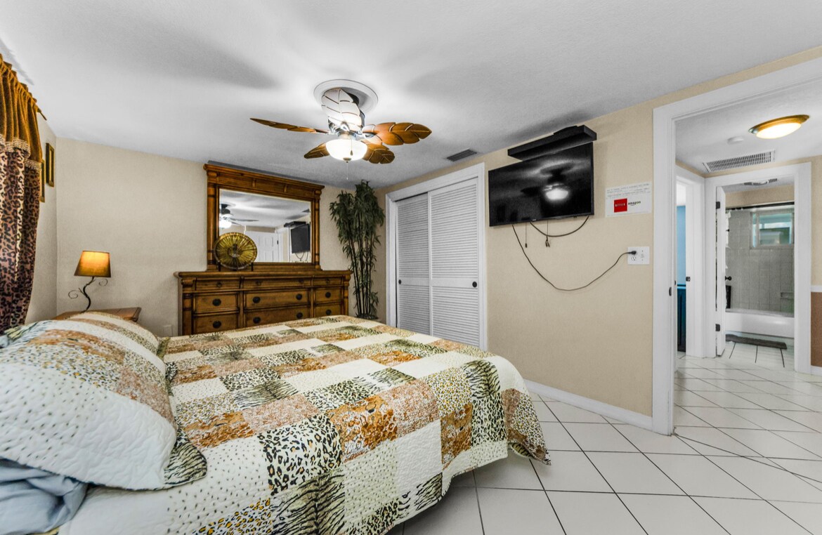 Master bedroom with matching dressers and closet. Mounted TV - 3931 Sail Dr