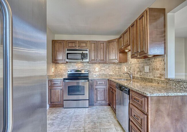 Building Photo - Updated End-of-Group Townhome with Finished Lower Level, Fenced Yard & Community Pool