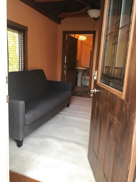 Sitting Room at Street Level with view of bathroom - 9031 E Circle Dr S