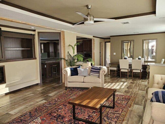 Open floor plan into the kitchen and dining room from living room *Picture from Owner's Purchase. - 179 Davis Rd