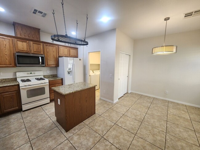 Building Photo - 4 bedroom townhome offers modern comfort i...