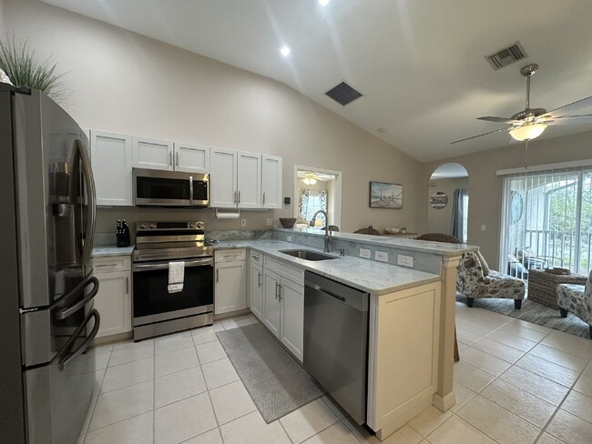 Building Photo - "Charming 2-Bed, 2-Bath Furnished Condo Oa...