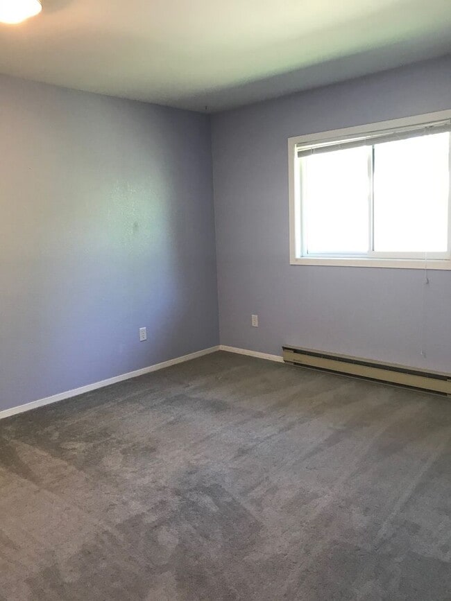 Building Photo - Charming 2-Bedroom Condo Near MSU – Pet Friendly- NEW LOW PRICE