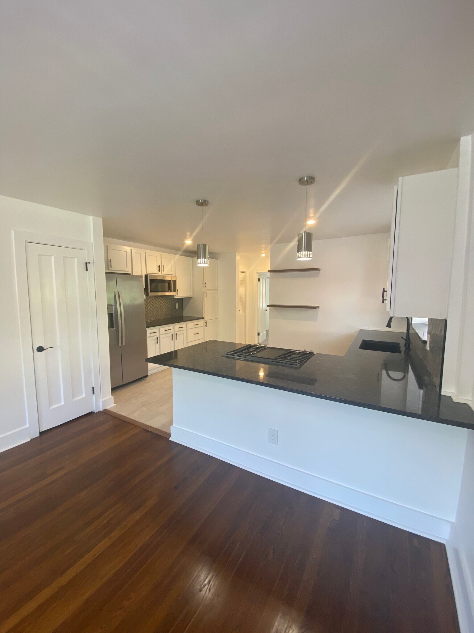 Black granite countertops with SS appliances - 3035 Cleinview Ave