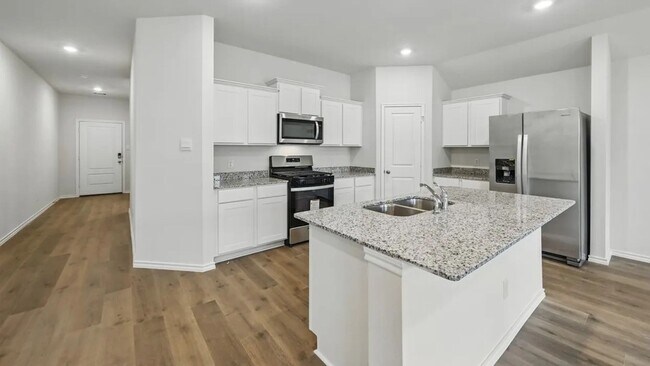Building Photo - Beautiful new 4-bedroom, 2-bath home with an open floor plan, granite kitchen, two-car garage, an...