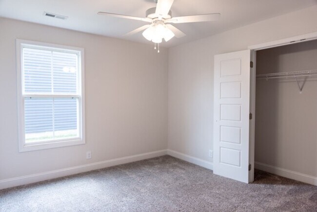 Building Photo - Modern Living Redefined with Stone Fireplace, Gray Cabinetry, Spa Inspired Primary Suite and Cove...