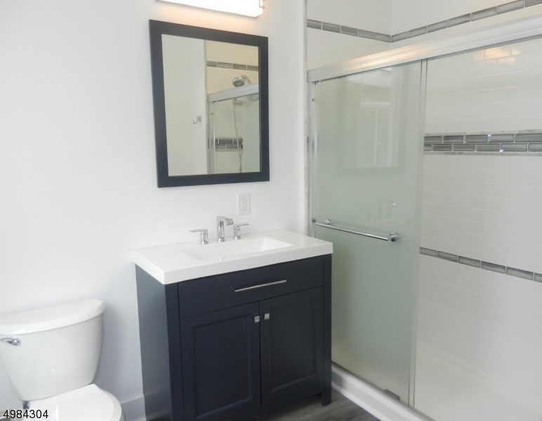 Master Bath Has Glass Enclosed Shower w/Decorative Vanity - 348 Millburn Ave