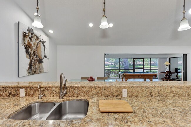 Building Photo - BEAUTIFUL 2 BEDROOM 2 BATHROOM + A DEN VILLA WITH GORGEOUS LAKE VIEWS!