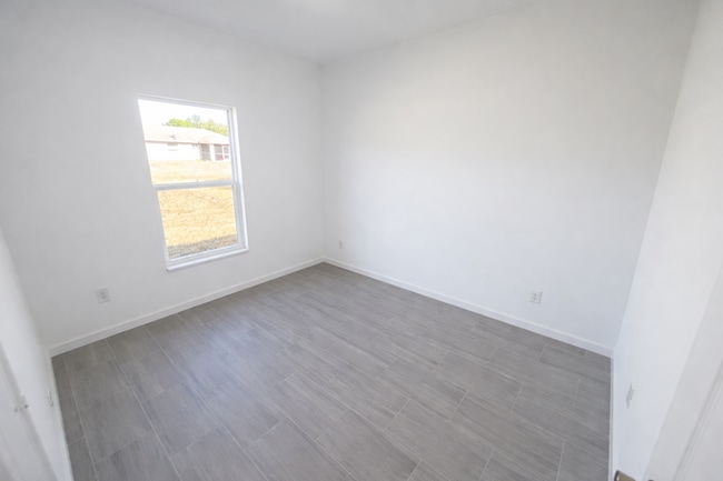 Building Photo - STUNNING NEW 3BR/2BA HOME WITH GARAGE -IN PRIME SW LEHIGH ACRES LOCATION