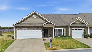 Building Photo - Experience refined, low-maintenance living in this beautifully appointed end-unit townhome