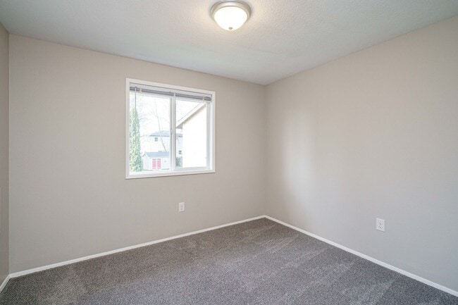 Building Photo - Recently Updated with Wood Laminate Flooring and Fresh Paint