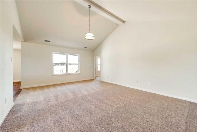 Building Photo - This lovely 4 bedroom home features a large family room with lots of light.
