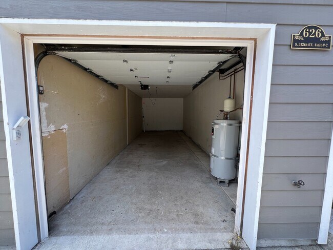 Building Photo - Elevated 3-Bedroom Home with Secure Garage & Cozy Living Space