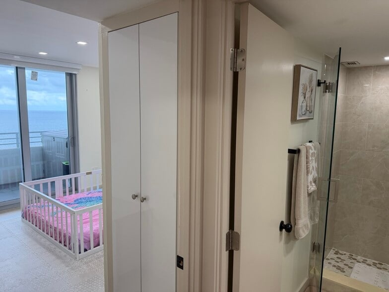 Primary Bathroom - Glass-Enclosed Walk-In Shower - 5555 Collins Ave
