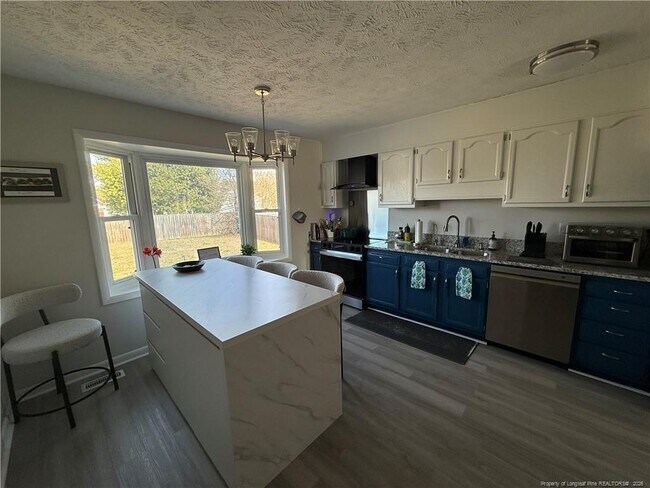 Building Photo - 7891 Uriah Dr