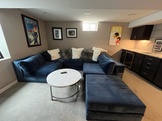Lower living area with bar and fridge - 2840 Leyden St