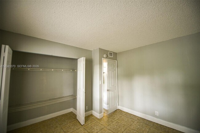 Building Photo - 703 Gardens Dr