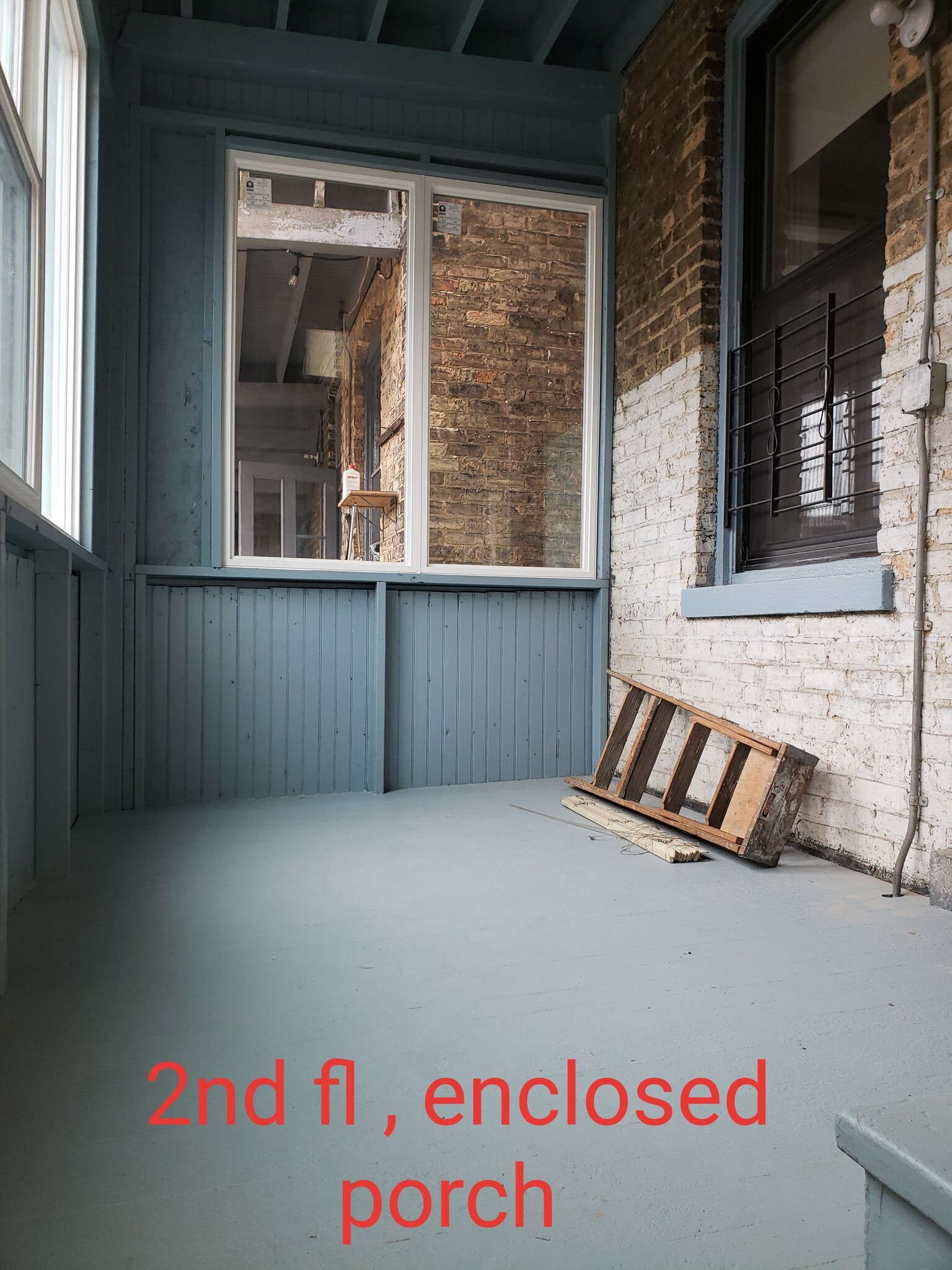 2nd floor, enclosed rear porch - 912 W Newport Ave