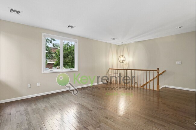 Building Photo - Spacious 2BR/2BA Duplex in Gated Community with Parking, Washer/Dryer & NYC Skyline Views