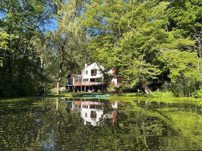 Building Photo - Stunning Updated Home with Private Pond Views in Chappaqua