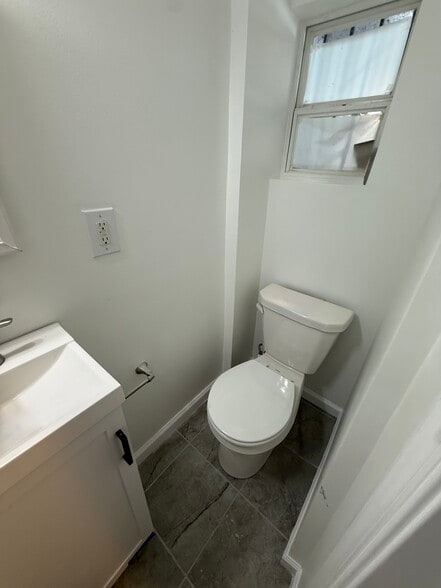 Toilet and vanity - 4506 Iowa Ave NW