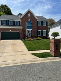 Building Photo - Updated & Landscaped 4 Bedroom, 4 Bath Hom...