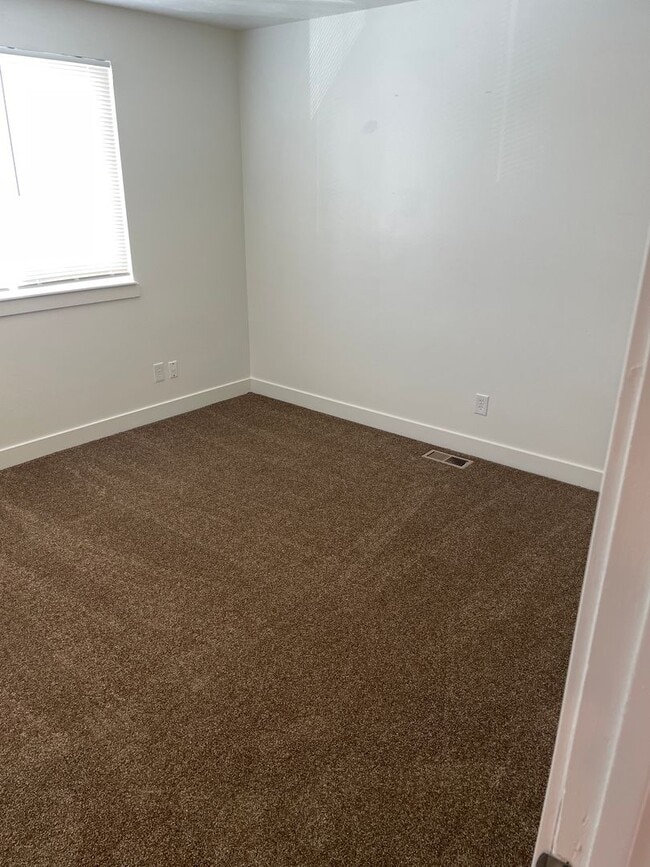 Building Photo - Spacious 3-bedroom 1.5 Bath Twin-Home with a Fenced Backyard