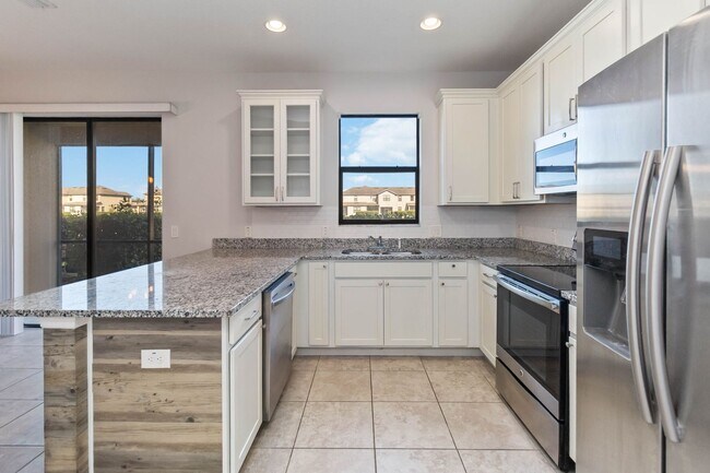 Building Photo - Bright & Stylish 3-Bedroom Townhome with Pond Views in Gated Seven Oaks