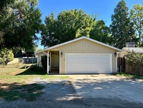 Building Photo - Charming Redding Home with Fireplace & Vau...
