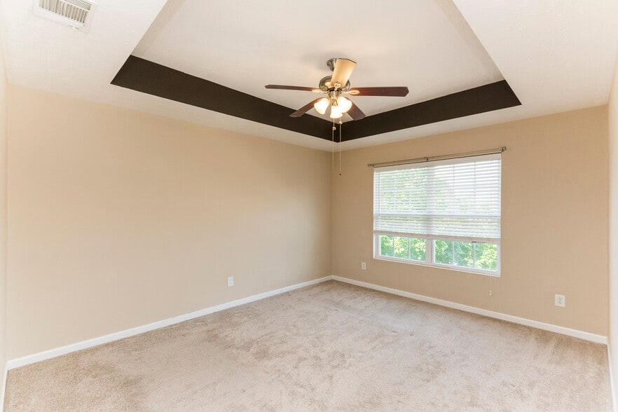 Primary suite with attached bath and large closet - 8725 Ambonnay Dr