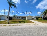 Building Photo - Gorgeous 3/2/1 1200 Sq. Ft. with fenced yard, all tile floors, custom baths and remodeled kitchen!!