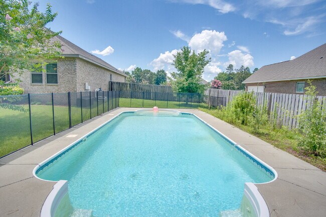 Building Photo - Spacious 4BR Pool Home with Modern Upgrade...
