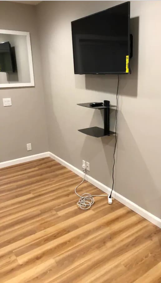 43" Smart TV with dual shelf system wall mounted - 275 croton dam road