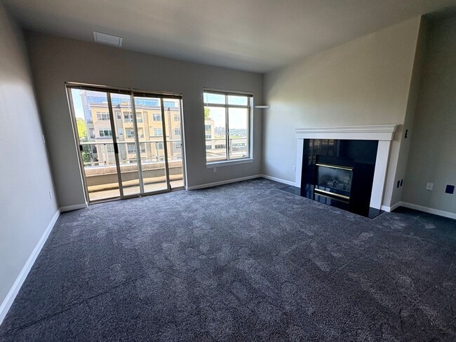 Building Photo - Top-Floor 2BR with Lake Union Views + Garage Parking + Internet Included!